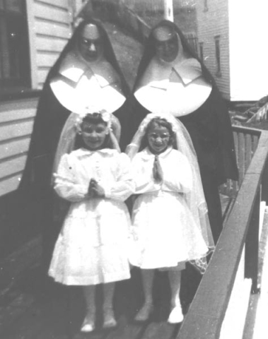 236: l-r Srs. Hildegarde and Camillus; Judy Ryan and Myra Carroll. First Communion. Mary Webber's  house in the background. (circa 1957) [courtesy of Marg (Ryan) Martin]  - Judy daughter of Francis Ryan &amp;amp; Elizabeth Barry; Myra daughter of Michael Carroll &amp;amp;  Josephine Barry; Srs. Hildegarde (Rose) and Camillus (Elizabeth) daughters of Patrick Dunphy  &amp;amp; Anastasia (Fitzgerald) McCarthy